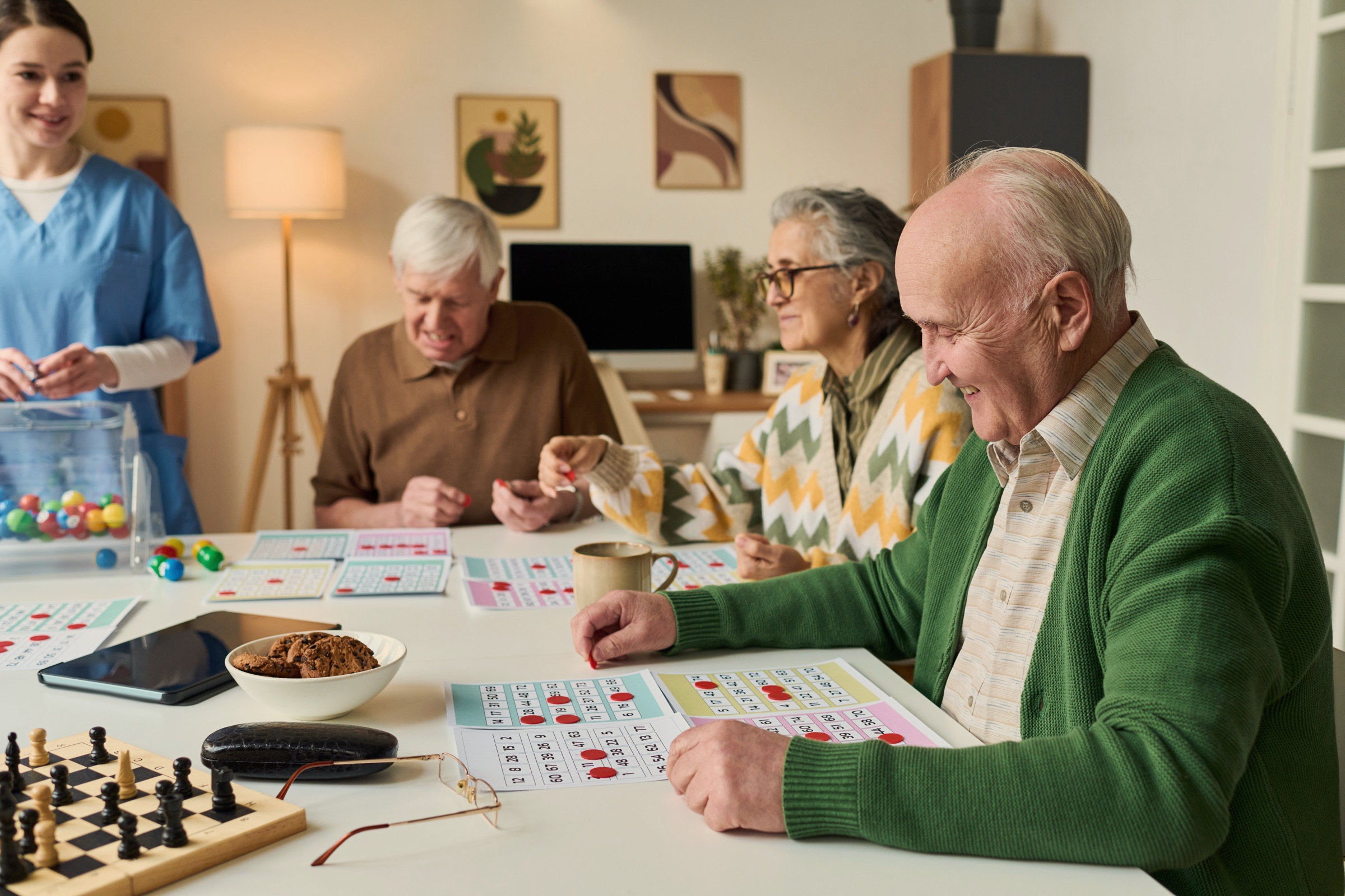 Residents talking over coffee at a round table